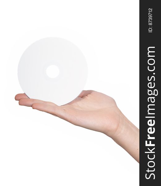The female hand holds  a disk on a white background. The female hand holds  a disk on a white background