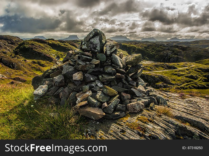 A hill landscape with a pile of rocks. A hill landscape with a pile of rocks.