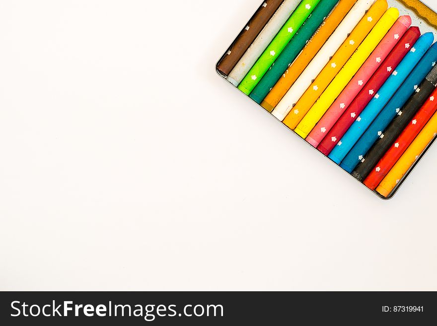 Multi Colored Pencils over White Background