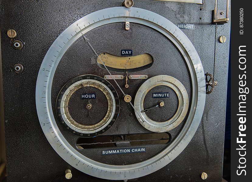 Dials for tide height &#x28;outer ring&#x29;, date, and time on Tide Predicting Machine No. 2, a special purpose mechanical analog computer for predicting the height and time of high and low tides. When the machine was in operation, the operator recorded the height and time of high and low tides, which were later reproduced in printed tide tables. The U.S. government used Tide Predicting Machine No. 2 from 1910 to 1965 to predict tides for ports around the world. The machine, also known as â€œOld Brass Brains,â€ uses an intricate arrangement of gears, pulleys, chains, slides, and other mechanical components to perform the computations. A person using the machine would require 2-3 days to compute a yearâ€™s tides at one location. A person performing the same calculations by hand would require hundreds of days to perform the work. The machine is 10.8 feet &#x28;3.3 m&#x29; long, 6.2 feet &#x28;1.9 m&#x29; high, and 2.0 feet &#x28;0.61 m&#x29; wide and weighs approximately 2,500 pounds &#x28;1134 kg&#x29;. The operator powers the machine with a hand crank. Dials for tide height &#x28;outer ring&#x29;, date, and time on Tide Predicting Machine No. 2, a special purpose mechanical analog computer for predicting the height and time of high and low tides. When the machine was in operation, the operator recorded the height and time of high and low tides, which were later reproduced in printed tide tables. The U.S. government used Tide Predicting Machine No. 2 from 1910 to 1965 to predict tides for ports around the world. The machine, also known as â€œOld Brass Brains,â€ uses an intricate arrangement of gears, pulleys, chains, slides, and other mechanical components to perform the computations. A person using the machine would require 2-3 days to compute a yearâ€™s tides at one location. A person performing the same calculations by hand would require hundreds of days to perform the work. The machine is 10.8 feet &#x28;3.3 m&#x29; long, 6.2 feet &#x28;1.9 m&#x29; high, and 2.0 feet &#x28;0.61 m&#x29; wide and weighs approximately 2,500 pounds &#x28;1134 kg&#x29;. The operator powers the machine with a hand crank.