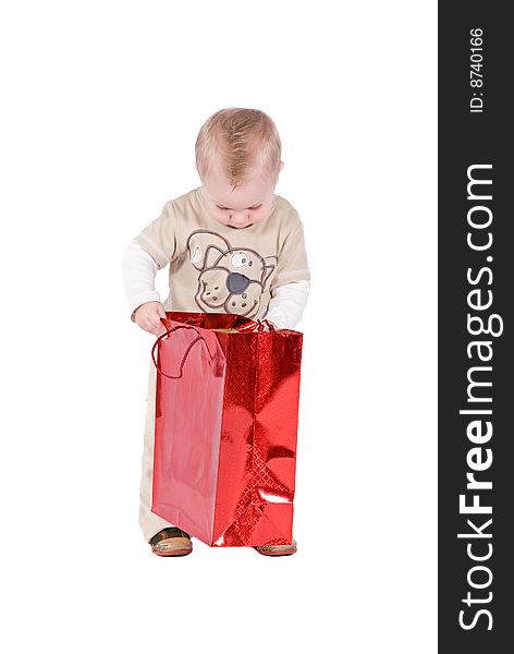 Happy kid with his present over a white background