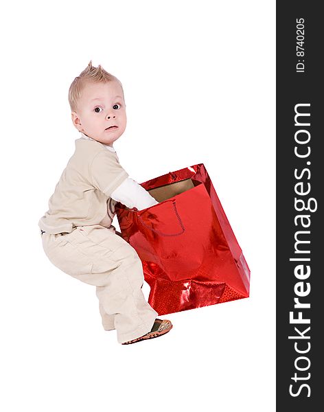 Happy kid with his present over a white background