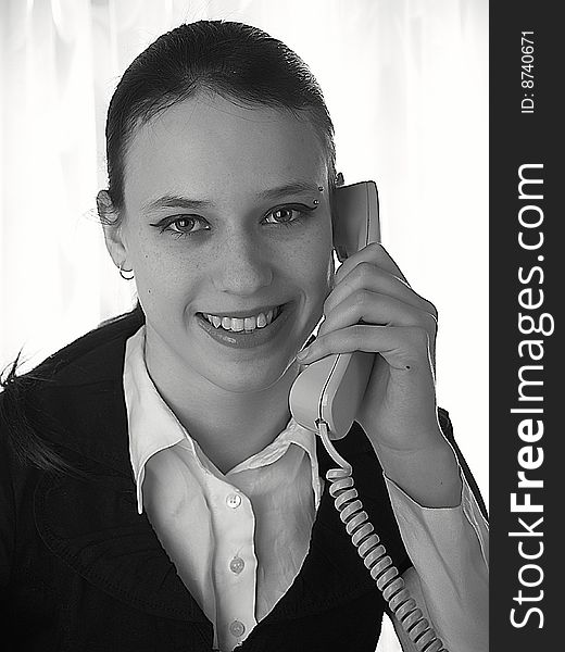 Attractive young woman calling by phone. Attractive young woman calling by phone