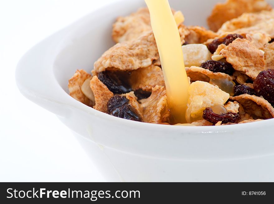 Bowl with cornflakes isolated on white