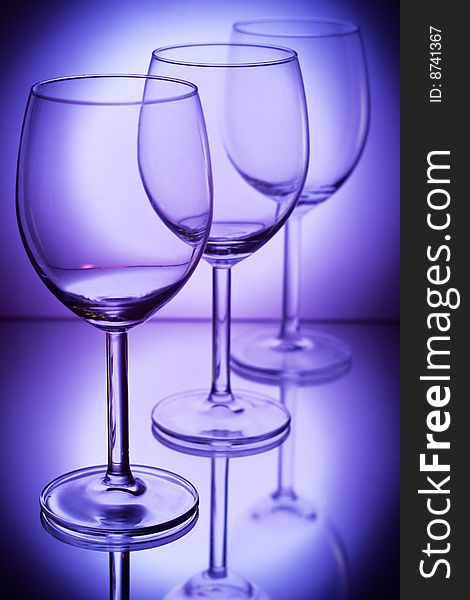 Wine glasses on a dark blue background