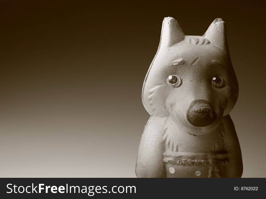 Toy wolf on a black and white backgrounf