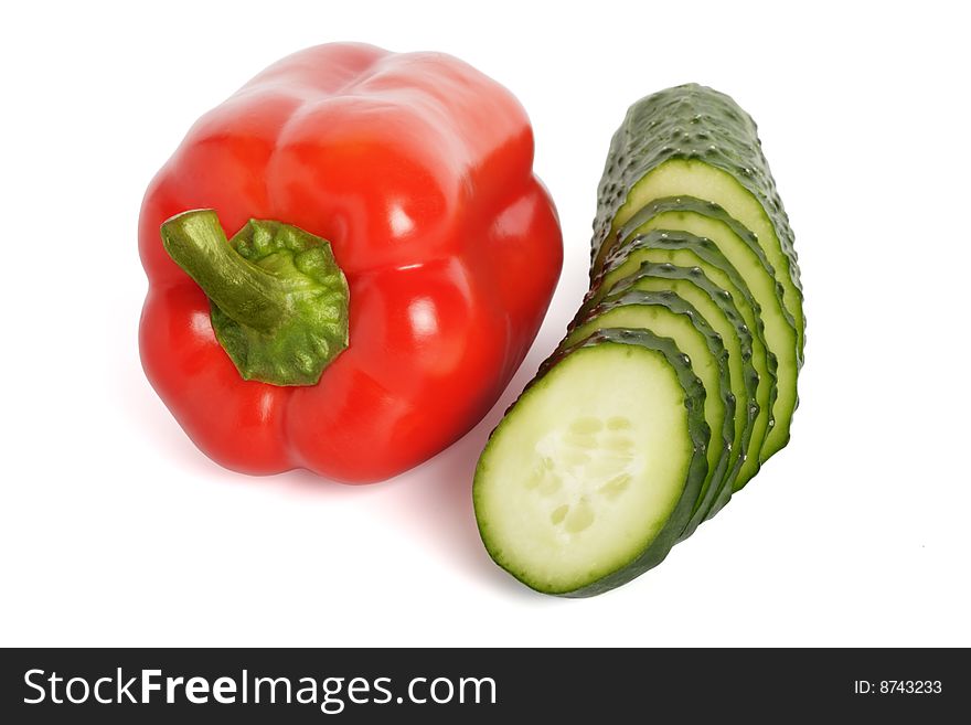 Red pepper and cucumber are isolated on a white background