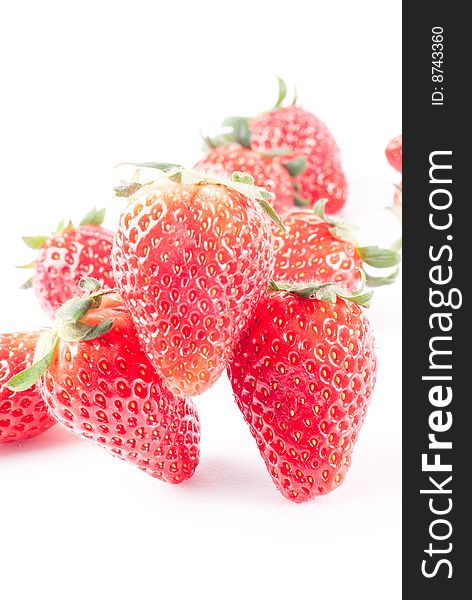 Fresh juicy standing strawberry isolated on white