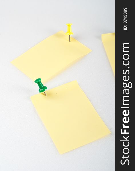Yellow post it note with color pin isolated. Yellow post it note with color pin isolated