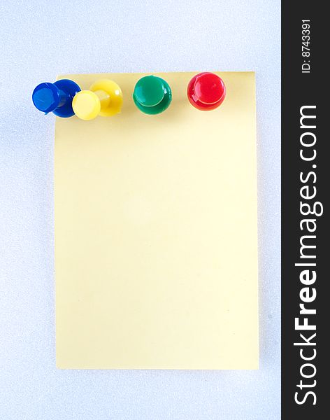 Yellow post it note with color pin isolated. Yellow post it note with color pin isolated