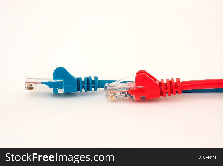 Multiple different colored ethernet cables on a white background. Multiple different colored ethernet cables on a white background