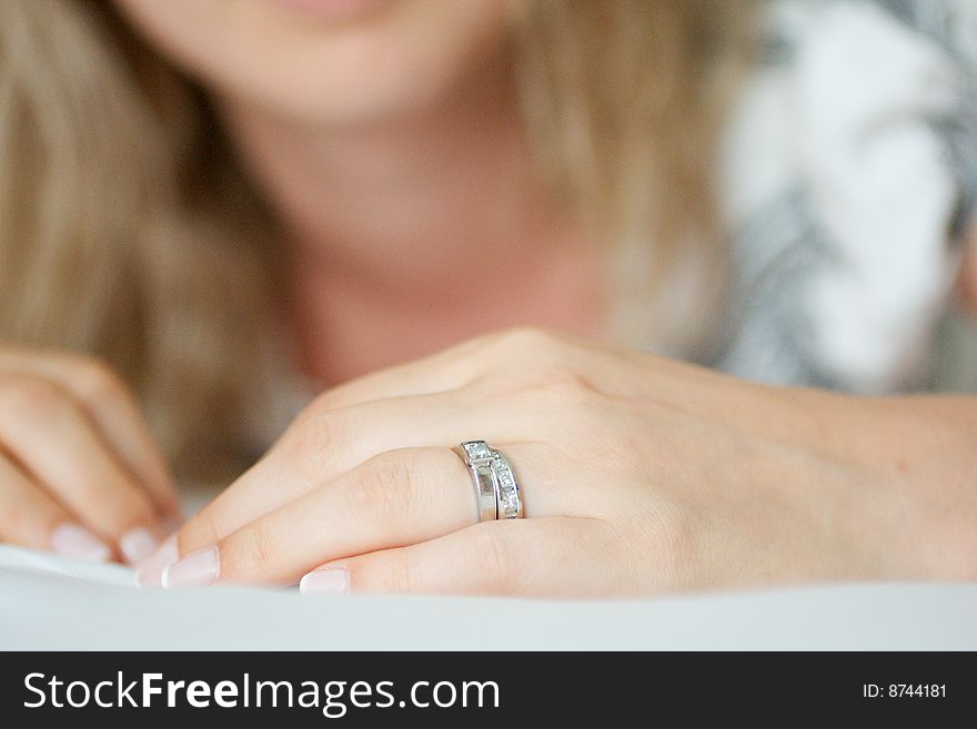 Woman displaying wedding rings on left hand. Woman displaying wedding rings on left hand