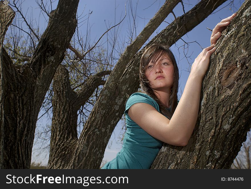 Teen girl in tree