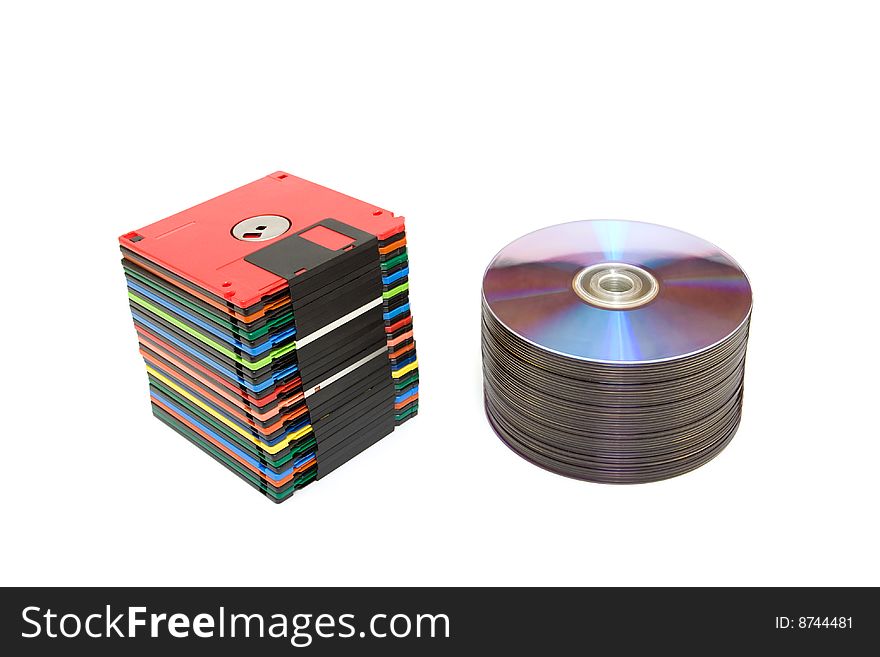 Stack of compact and floppy disk isolated on white