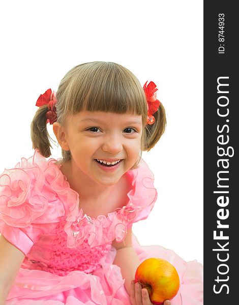 Young girl in pink dress with red and yellow apple in her hand. Young girl in pink dress with red and yellow apple in her hand