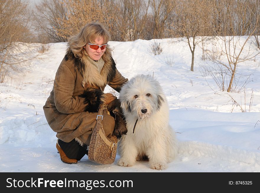 Woman and puppy south russian sheep dog