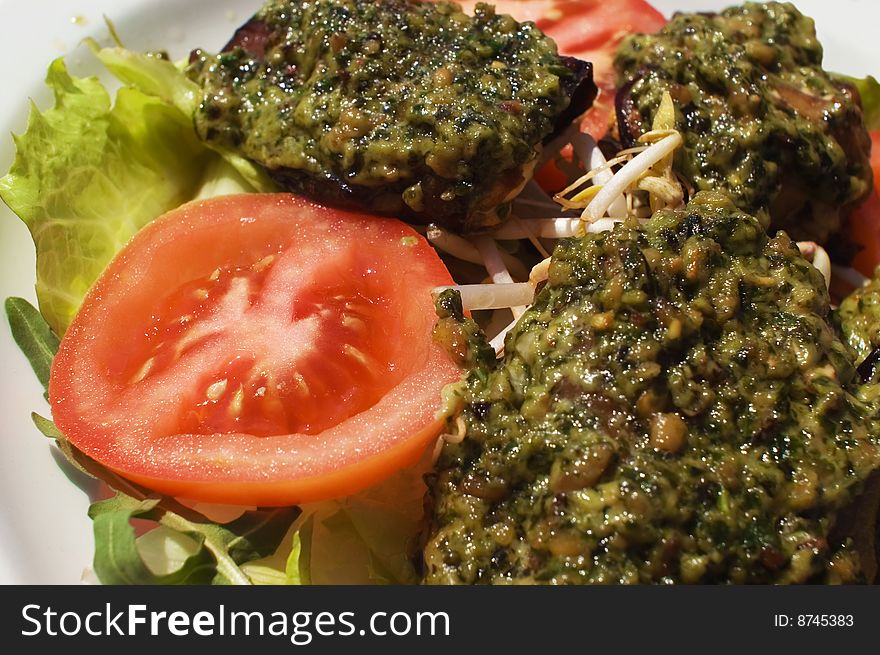 Eggplant rolls creamed with a pesto sauce. Eggplant rolls creamed with a pesto sauce