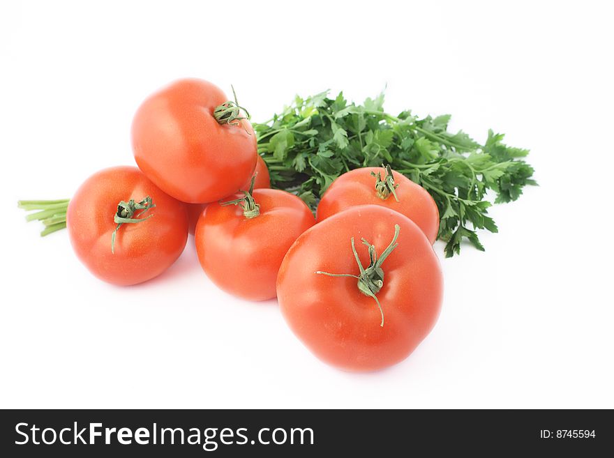 Tomatoes with parsley over white background