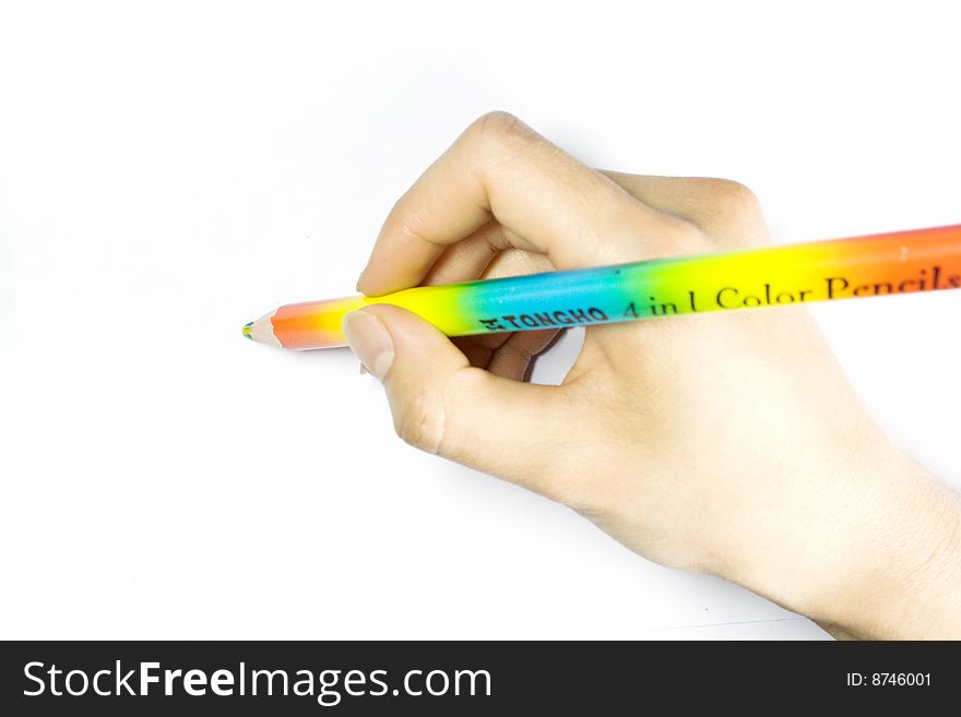 Close-up shot of a girl's hand, holding a pencil. Close-up shot of a girl's hand, holding a pencil