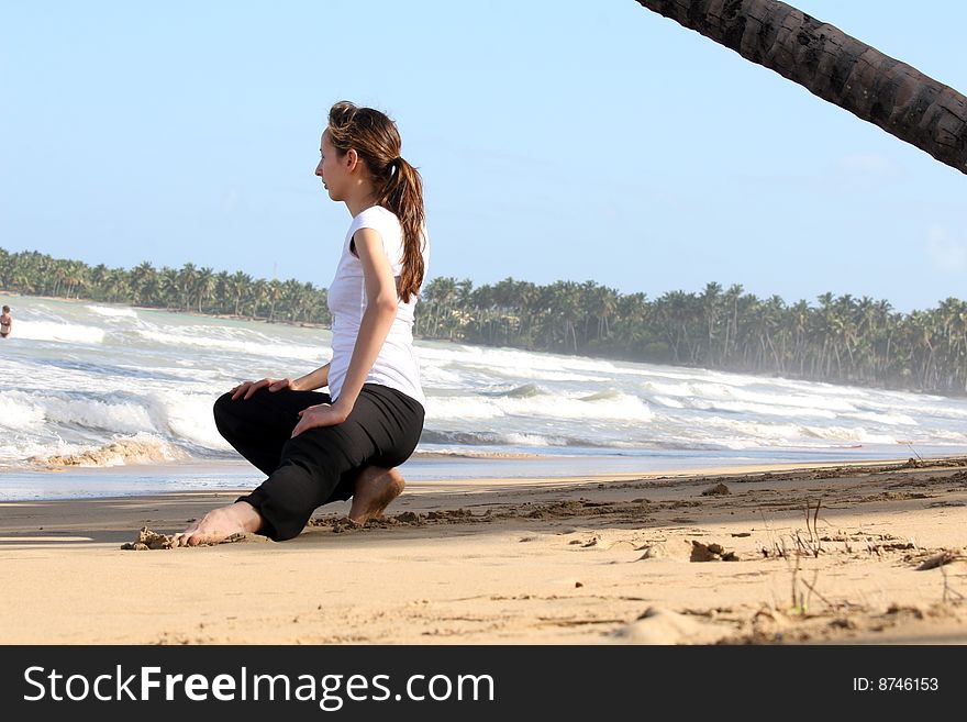 Stretching and yoga exercises on the beach. Stretching and yoga exercises on the beach