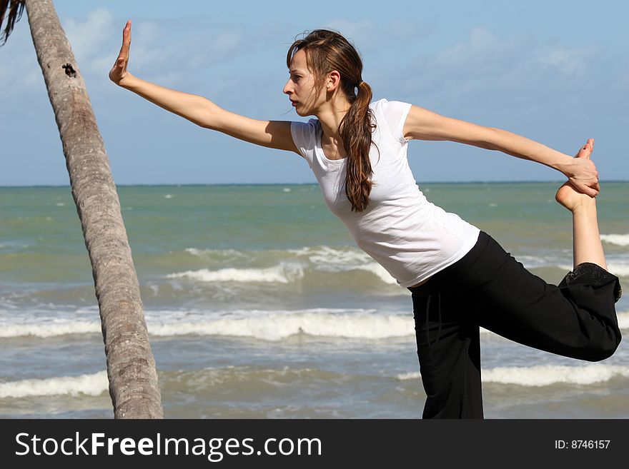 Stretching and yoga exercises on the beach. Stretching and yoga exercises on the beach
