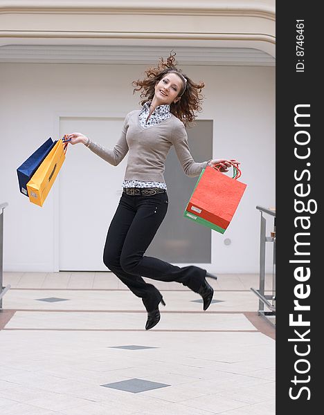 Young Girl With Colored Bags