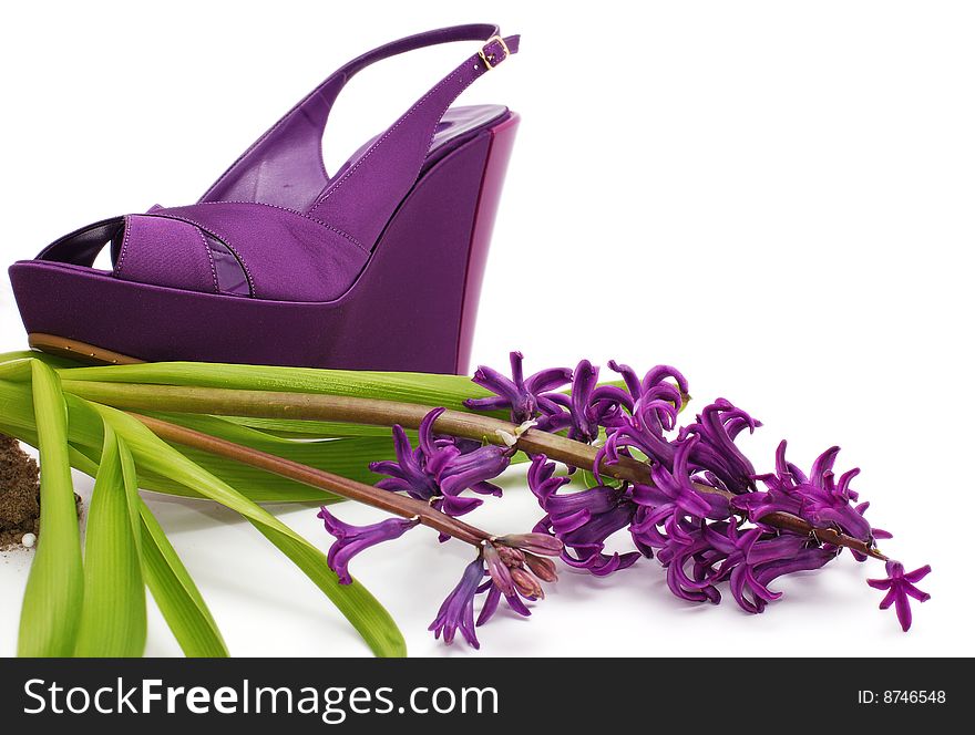 Fashion platform shoe with flower close-up isolated over white. Fashion platform shoe with flower close-up isolated over white