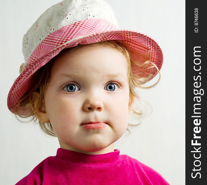 Stock photo: an image of a nice baby in a pink hat