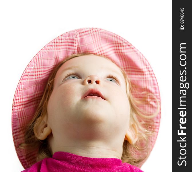 Stock photo: an image of a baby in a hat looking up