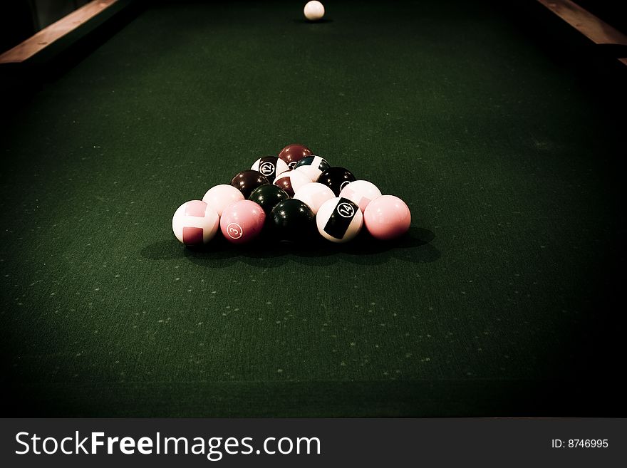 Vintage billiard balls on green table