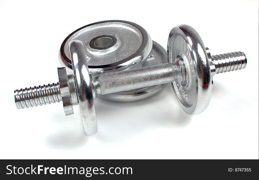 A metal dumbbell isolated on a white background, with shadow