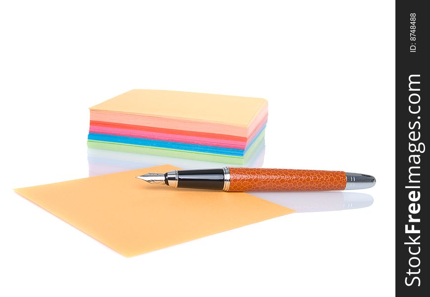 Notes block and pen isolated on a white background.