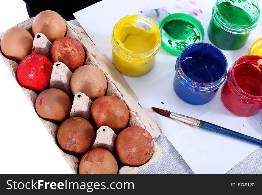 Preparing painting easter egg with brush