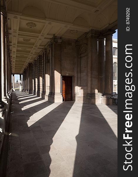 An external corridor at Greenwich University in London with an interesting play of shadows and light. An external corridor at Greenwich University in London with an interesting play of shadows and light