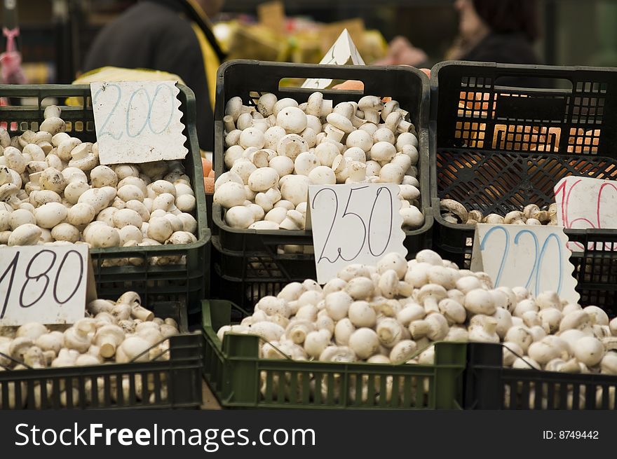 White mushrooms in baskets at Belgrade (Serbia) flow market. White mushrooms in baskets at Belgrade (Serbia) flow market