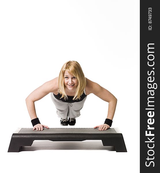 Woman working out towards white background