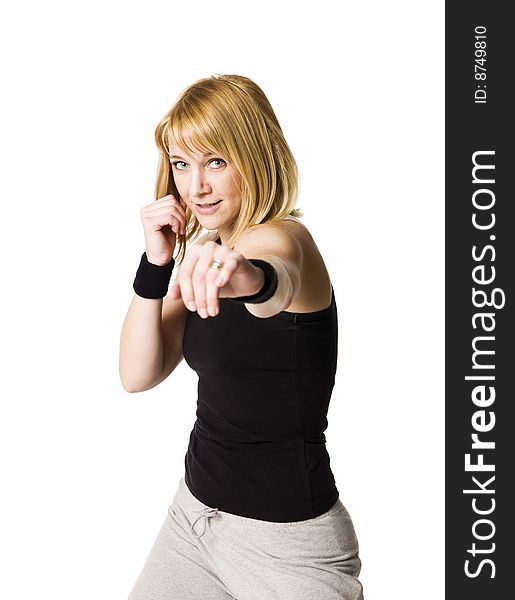 Girl boxing towards white background