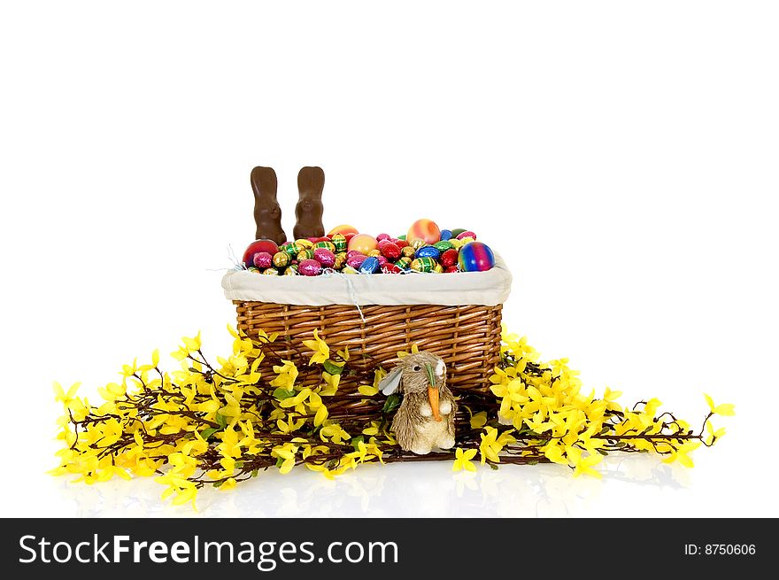 Basket with boiled and chocolate Easter eggs on white background, reflective surface. Basket with boiled and chocolate Easter eggs on white background, reflective surface