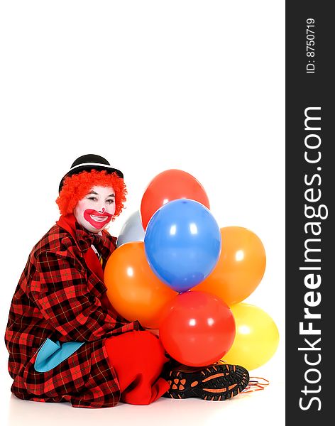 Happy smiling female clown, colorful dressed, studio shot on white background. Happy smiling female clown, colorful dressed, studio shot on white background