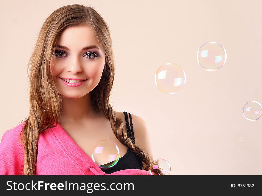 Happy woman with bubbles isolated