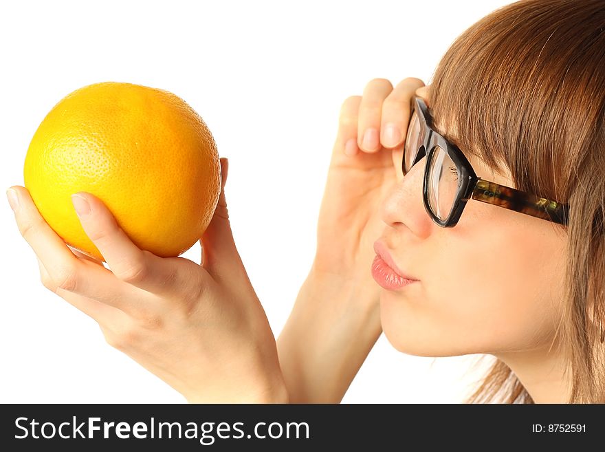 Young woman in big glasses looking to orange
