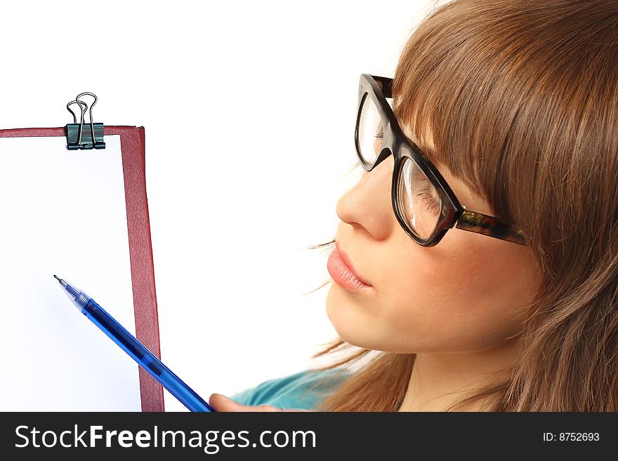 Young woman in glasses showing to blank paper field