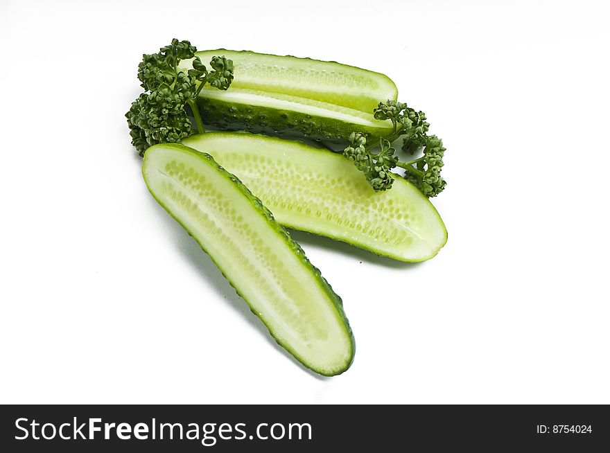 Cutted cucumbers and parsley, healthy food isolated on white