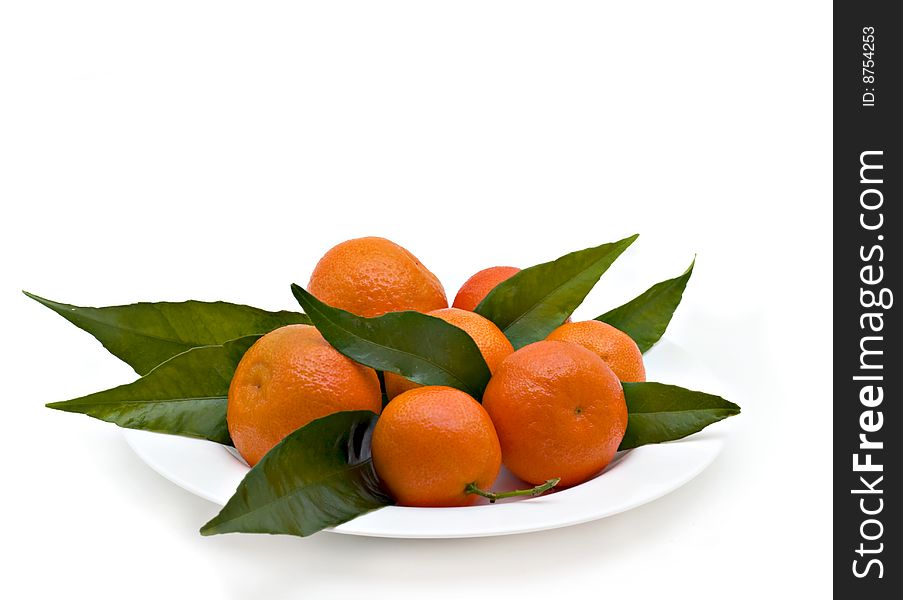 Tangerines with leaves isolated on a white background