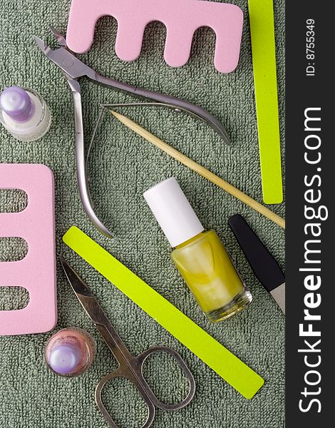 Pedicure beauty set on towel background