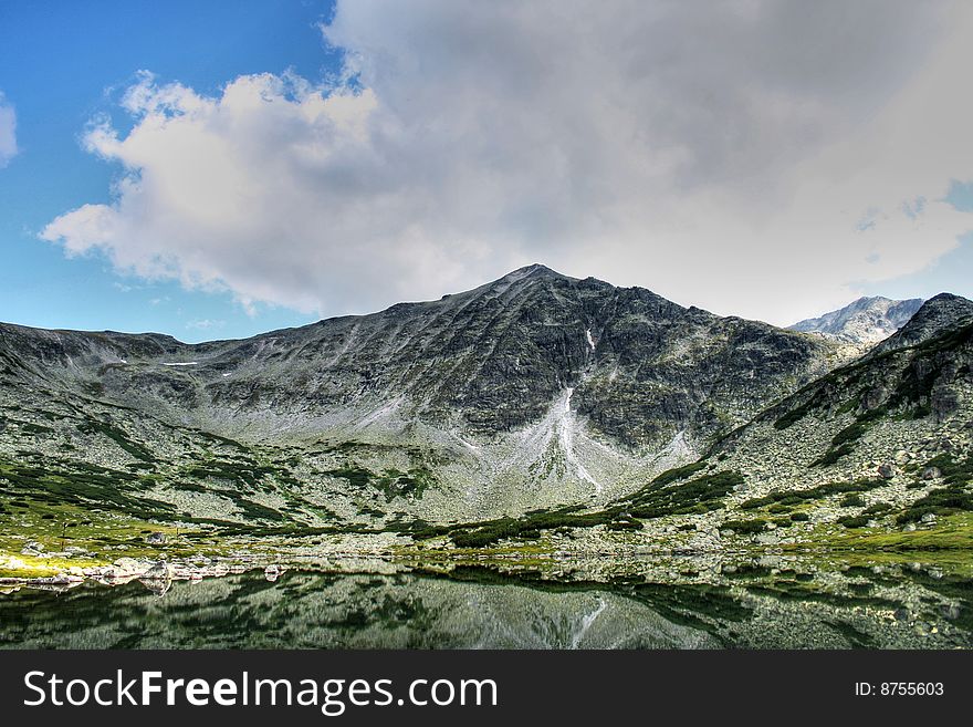 The glacial lake in the Rila (bulgarian mountains). The glacial lake in the Rila (bulgarian mountains)