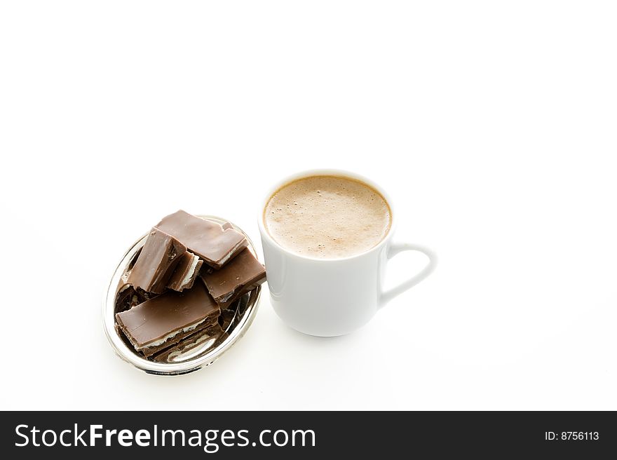 Coffee, chocolate and cup of water on a plat