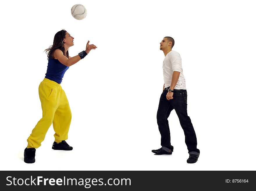 Full body view of couple of young man and woman in casual wear, playing with a soccer ball. Isolated on white background. Full body view of couple of young man and woman in casual wear, playing with a soccer ball. Isolated on white background.