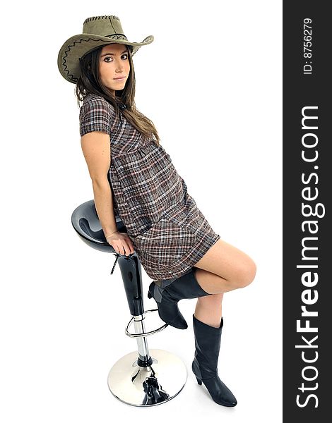 Full body view of young fashion model with cowboy hat, short dress and high heels. Isolated on white background. Full body view of young fashion model with cowboy hat, short dress and high heels. Isolated on white background.