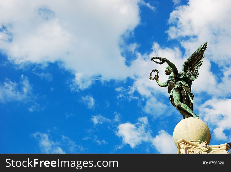 Statue on the top of a pillar near the Museum of Fine Arts, Vienna, Austria